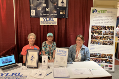 YLRL and WEST table. L-R: Anne Manna, WB1ARU; Barbara Irby, KC1KGS; Elena Spencer from WEST