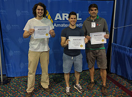 photo of three applicants holding certificates