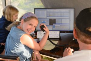 Girl operating radio at field day