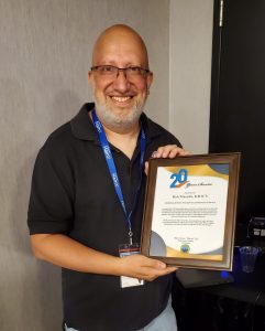 kD1CY holding 20 Year VoIP Award