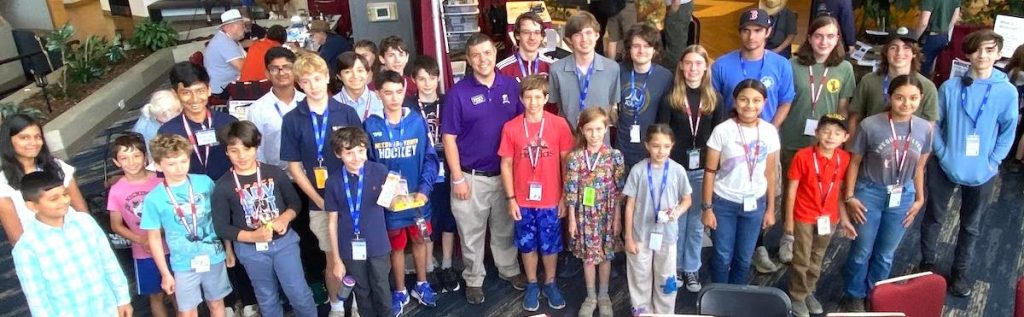 Group photo of 2025 HamX Youth Forum with Dr. Nathaniel A. Frissell, W2NAF of HamSCI